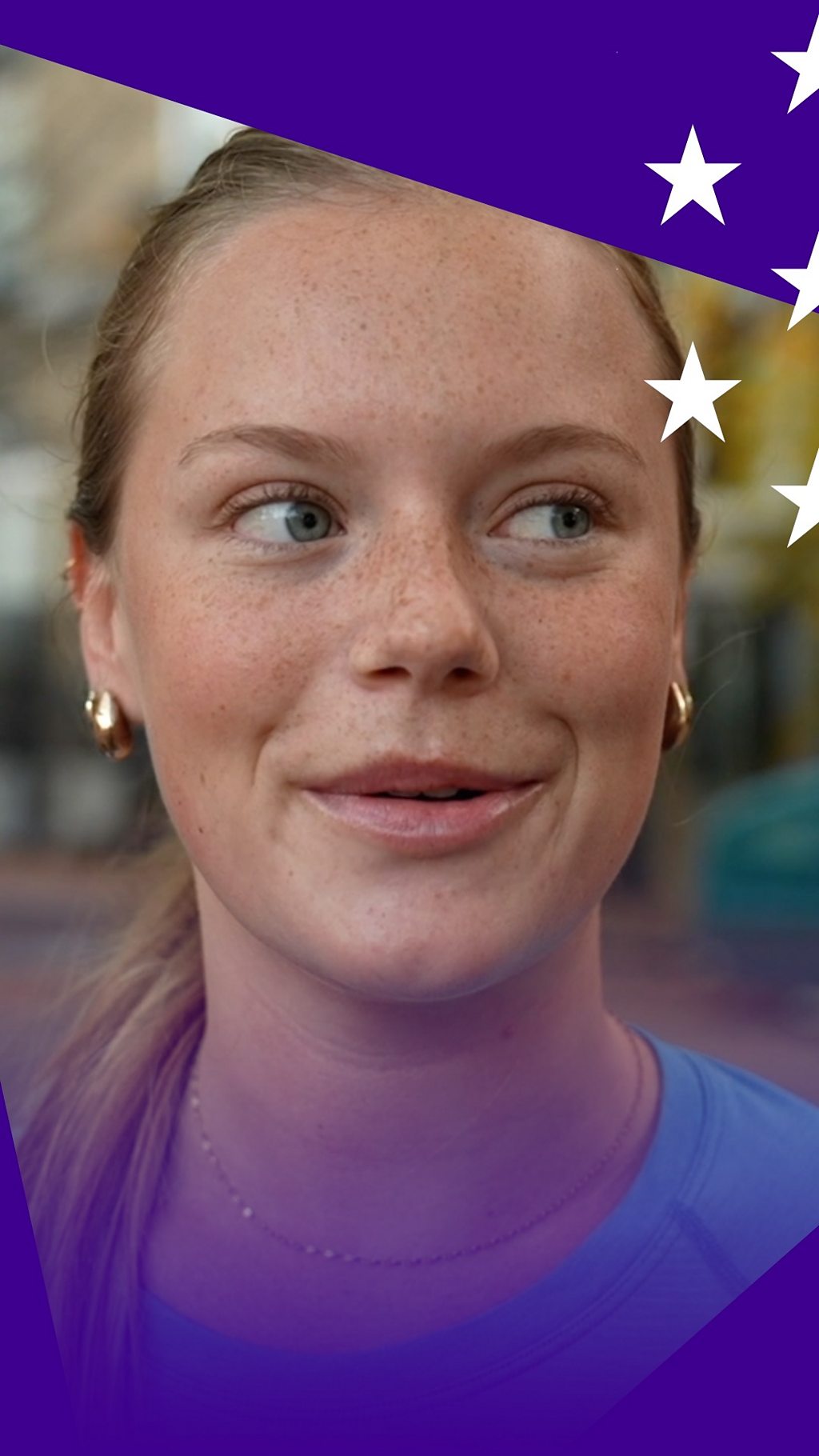 A young woman wearing a blue shirt