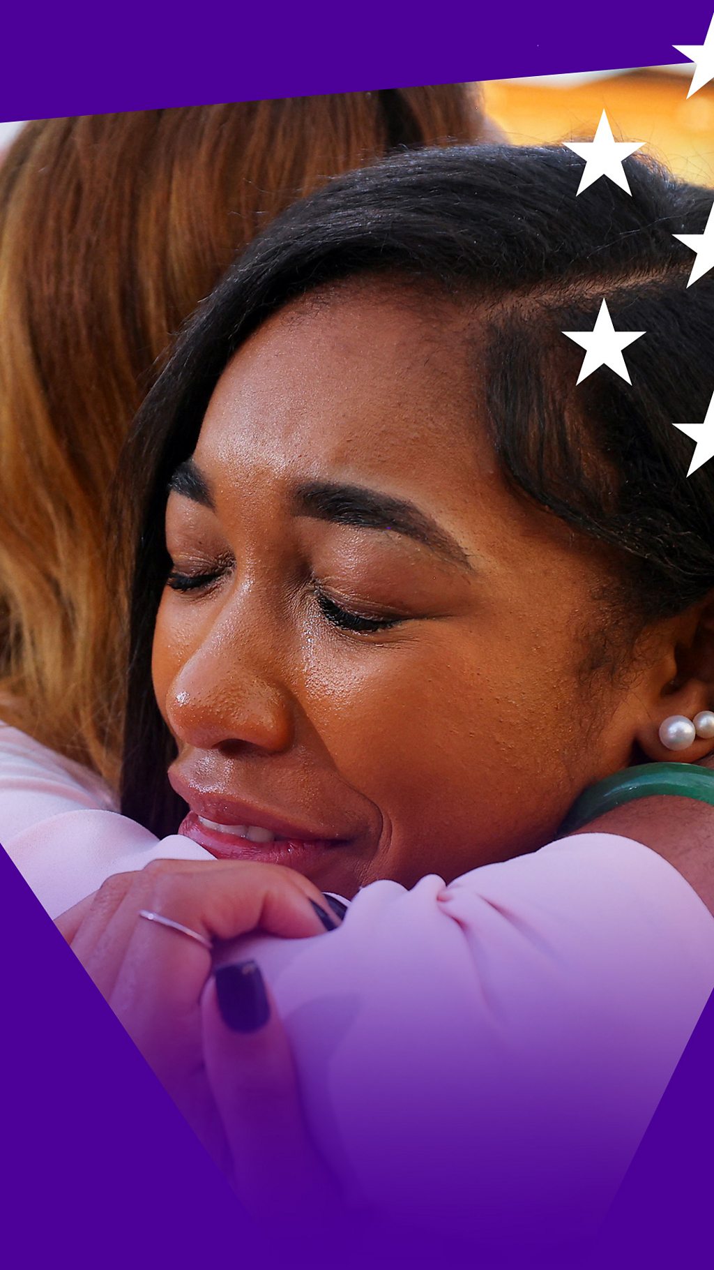 A woman hugging another woman at the Harris speech