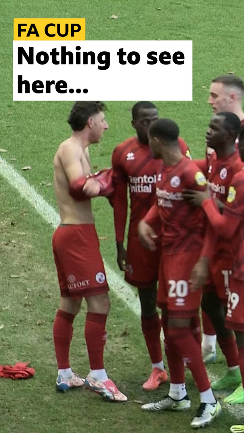 Crawley Town's Jack Roles takes off shirt in secret and the players surround him, so the referee doesn't see and card him.