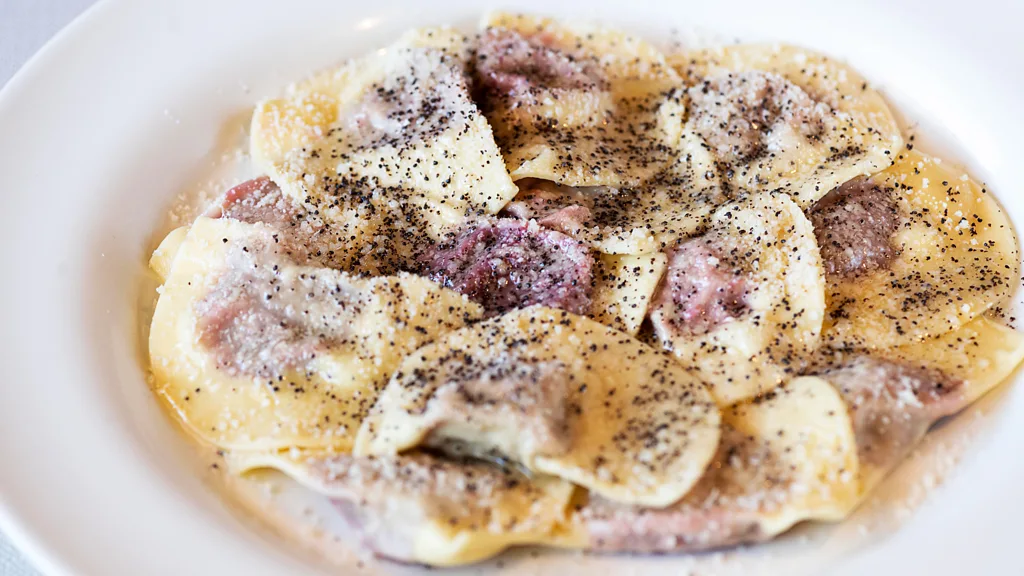 Local cuisine in the Dolomites is hearty for refuelling after long days in the snow, like a hot dish of casunziei ravioli stuffed with potatoes and turnip (Credit: Getty Images)