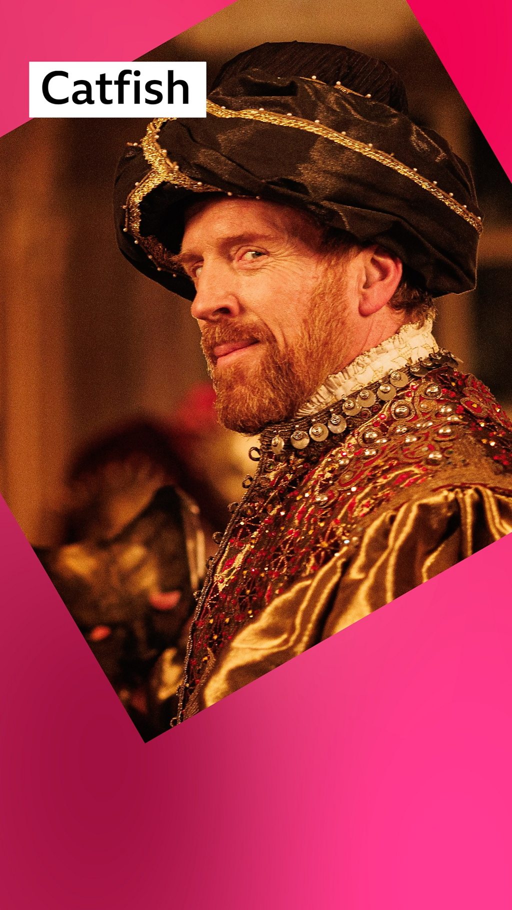 Damian Lewis as King Henry VIII wearing a Turkish style hat and gold costume. Label: Catfish