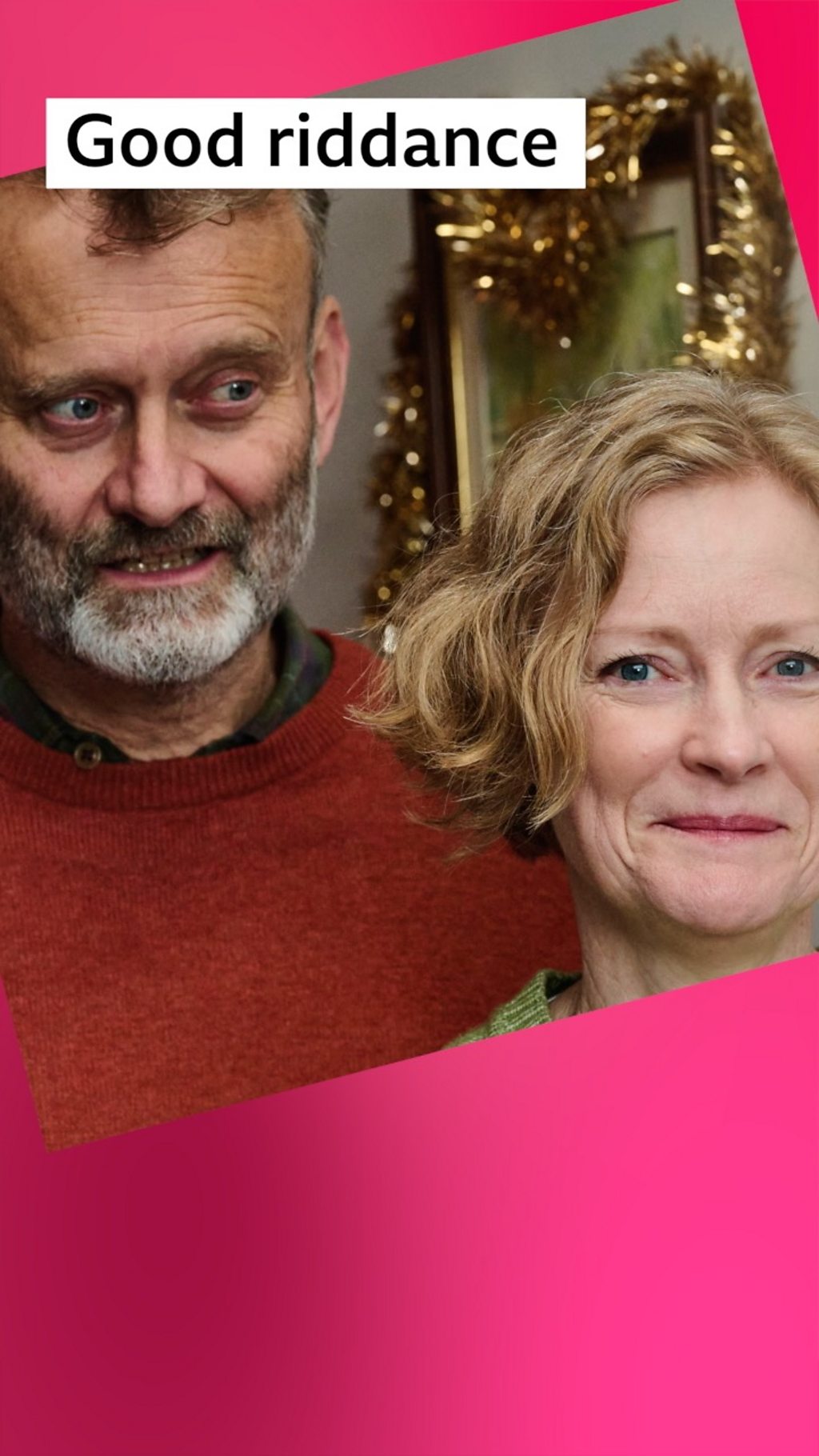 A man and a woman, Pete and Sue Brockman, stand in their doorway smiling