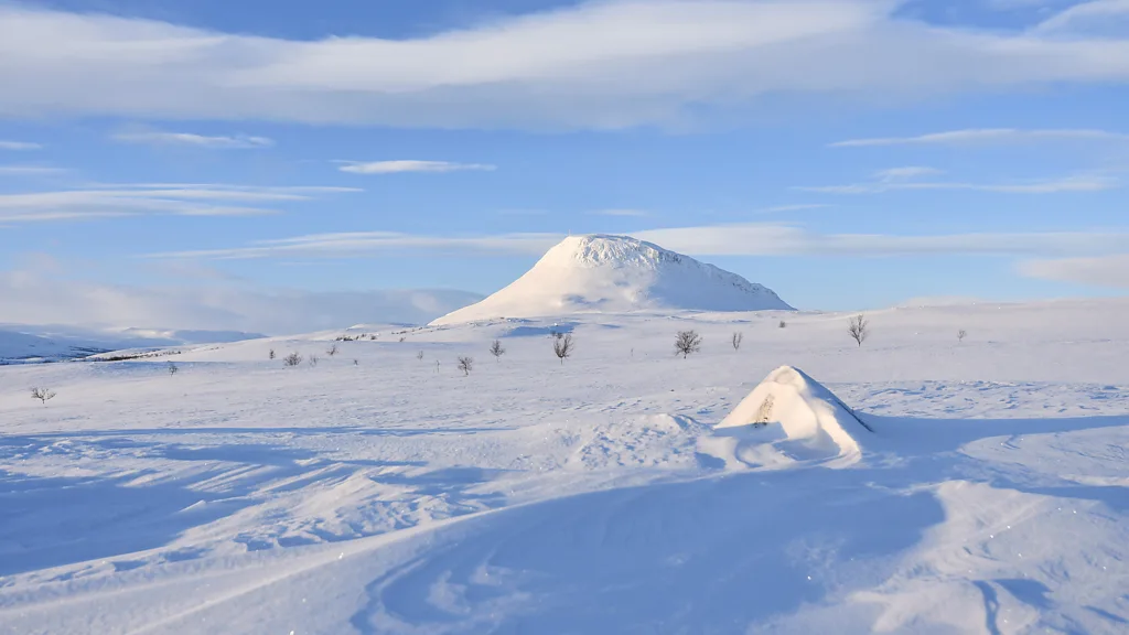 Mount Saana in Arctic Lapland provides ice swimmers with a remote, magical landscape (Credit: Suvi Mansikkasalo, courtesy of Visit Finland)