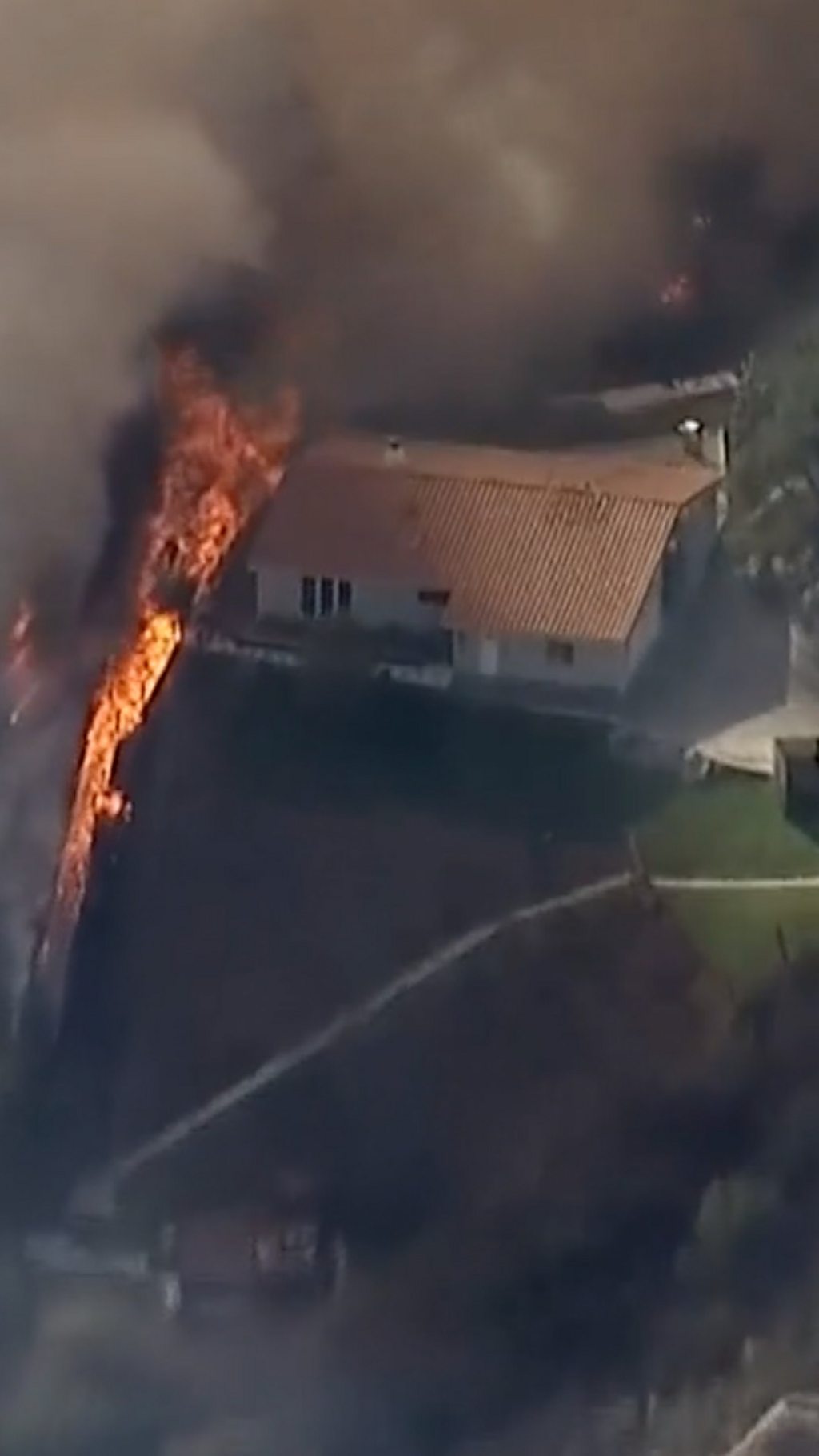 A burning home seen from above