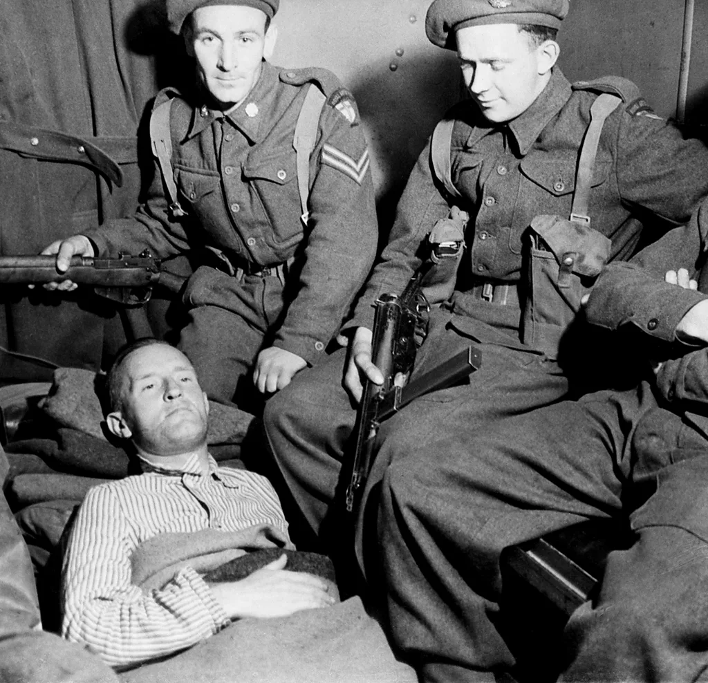 Pictured here in captivity in May 1945, Lord Haw-Haw was later hanged for treason (Credit: Getty Images)