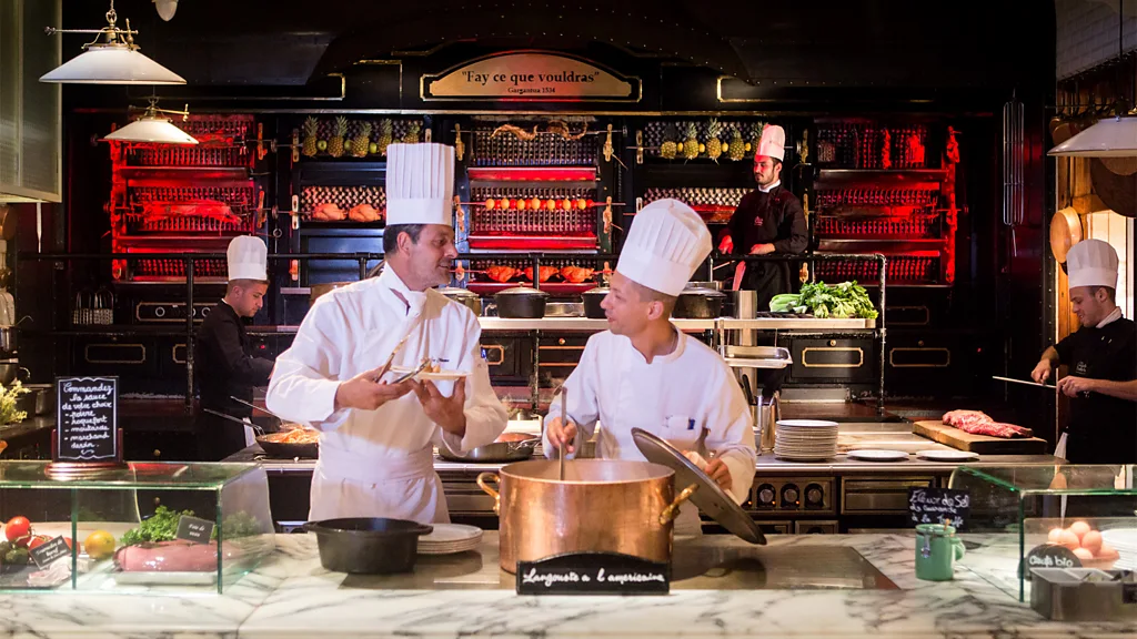 Chefs working in the open kitchen at Les Grands Buffets in Narbonne, France (Credit: Adrien Privat)