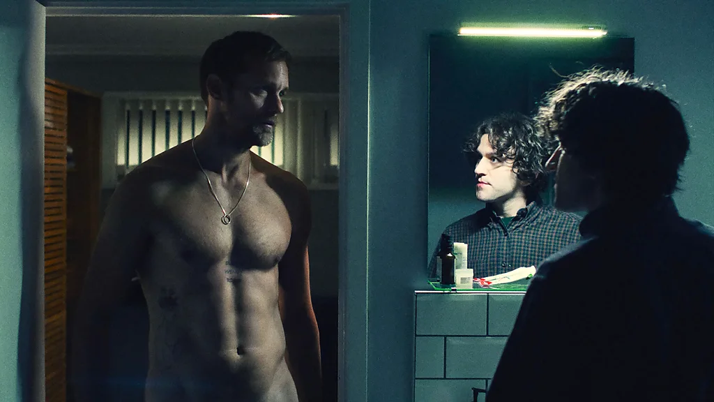 Ray (Alexander Skarsgård) remains a bewitching enigma through the film – but his lack of communication with Colin (Harry Melling) could be seen as unhealthy (Credit: A24)