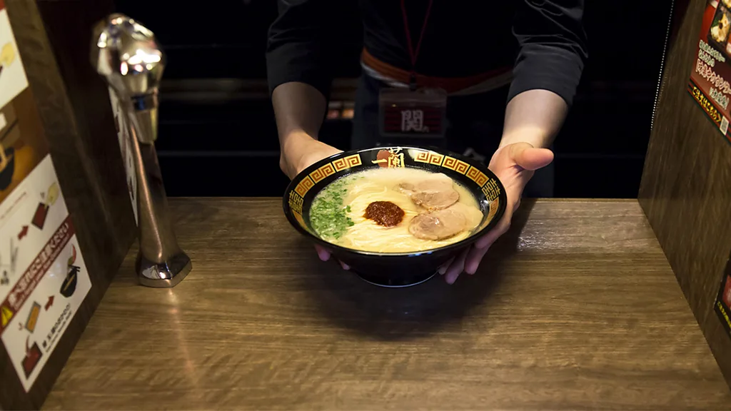 The single-seat booths at Ichiran are designed to minimise noise and interaction (Credit: Getty Images)