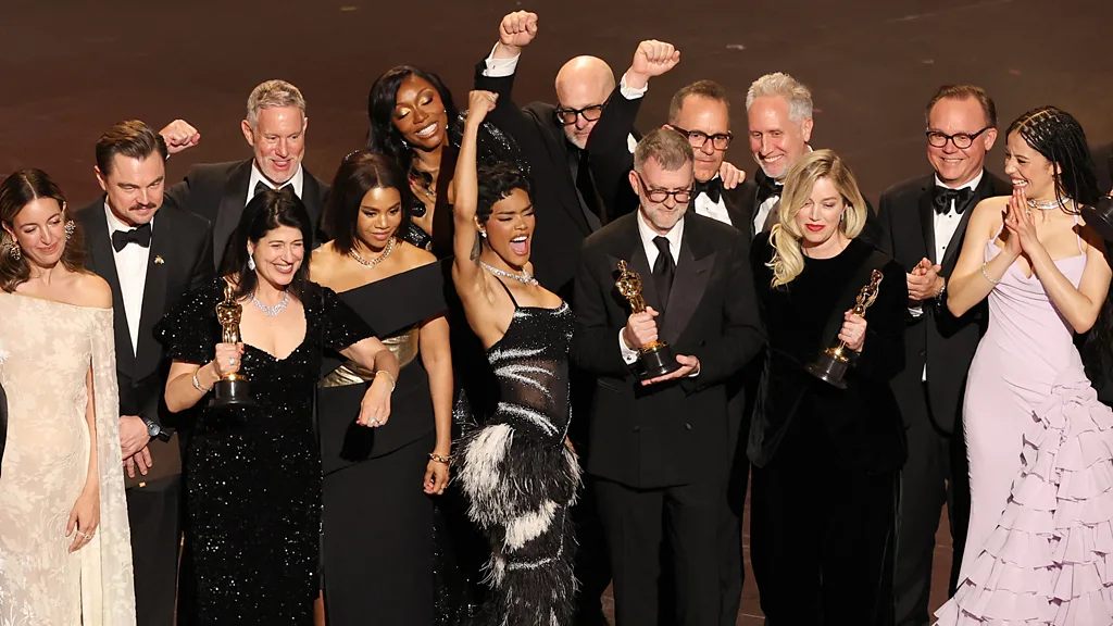 The team behind One Battle After Another accepts the award for best picture.