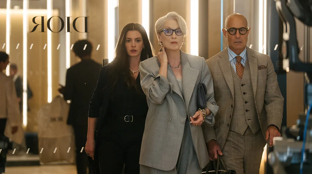 Meryl Streep in a red gown next to Stanley Tucci in The Devil Wears Prada 2 (Credit: 20th Century Fox)