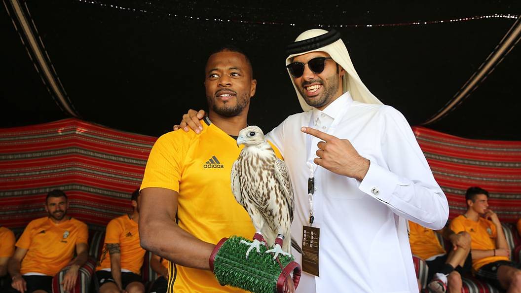 Patrice Evra holding a bird of prey