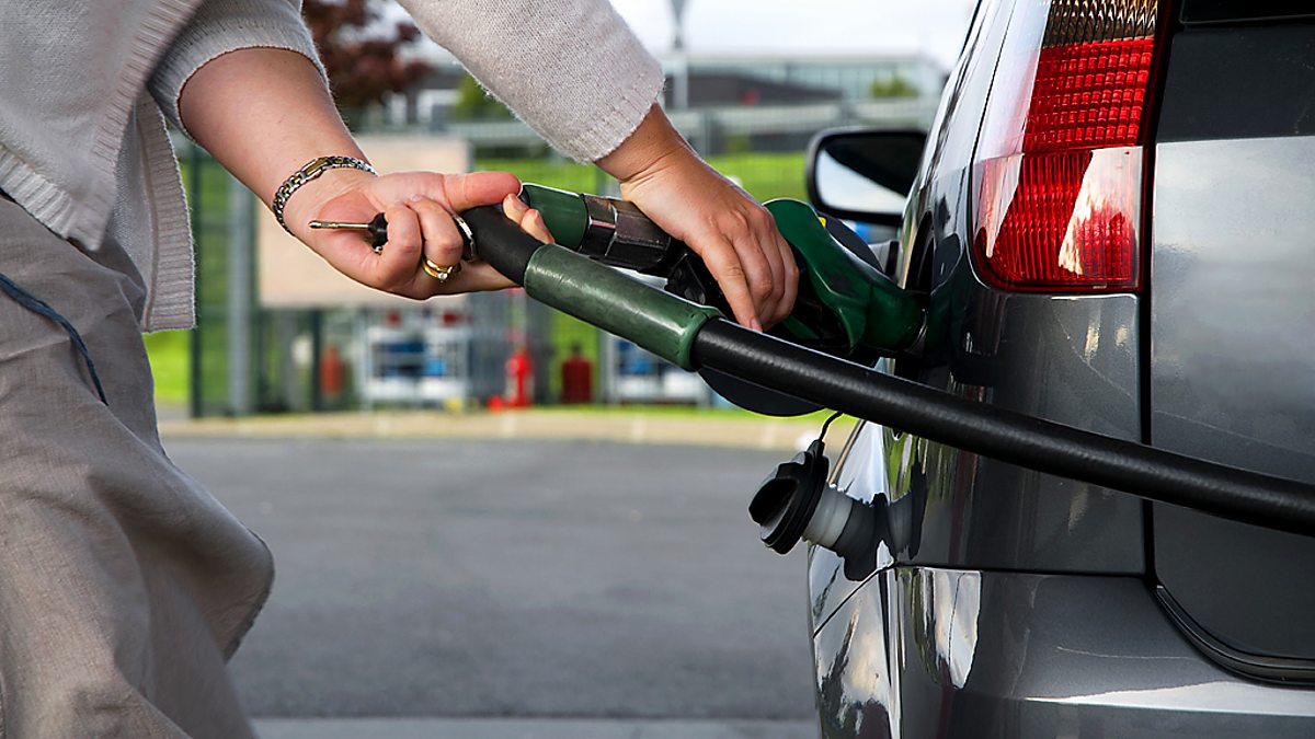 Fill in car. Gas up the car. Petrol on ground picture.