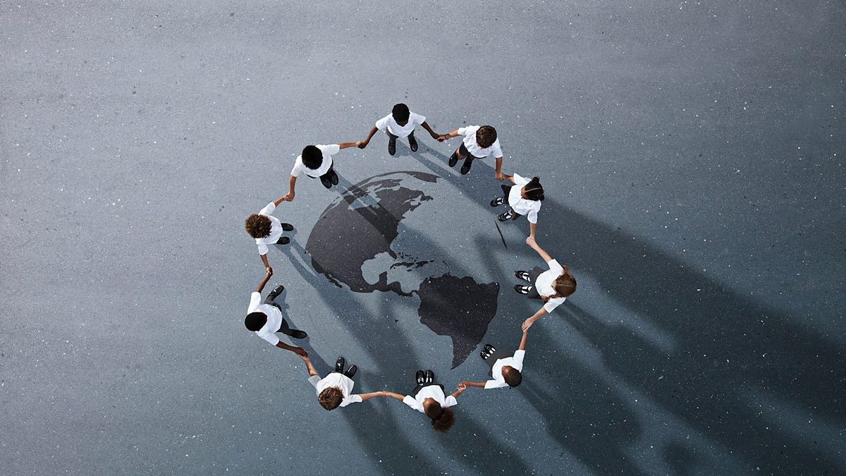 'a group of people holding hands in a circle'