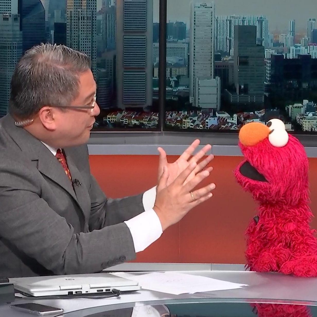 BBC newsreader interviews Sesame Street's Elmo