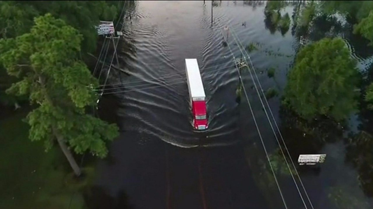 Storm Harvey: Drone shows trucks tackling Texas floods