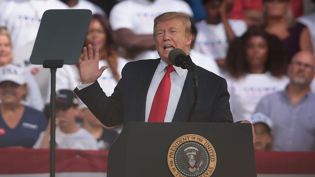 'Shoot them': Trump laughs off supporter's migrant comment