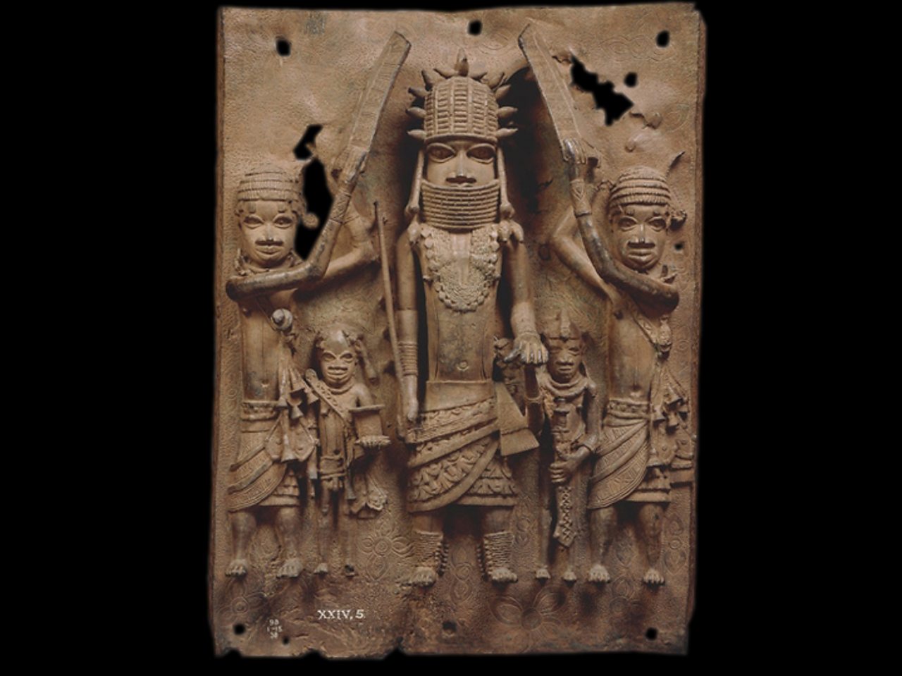 A brass plaque showing an Oba with his attendants.