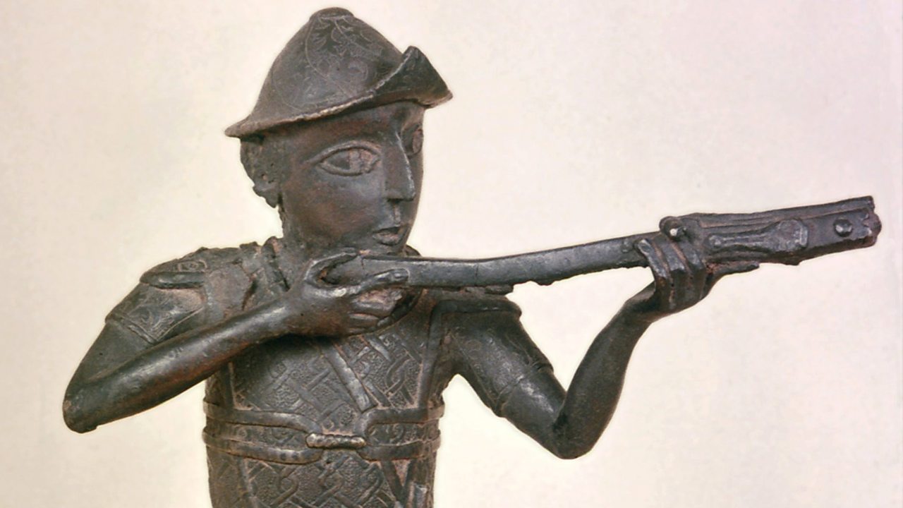 A brass figurine showing a soldier with a gun