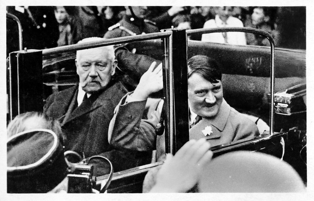 German President Paul von Hindenburg in a car with Nazi leader and Chancellor of Germany, Adolf Hitler in Berlin.