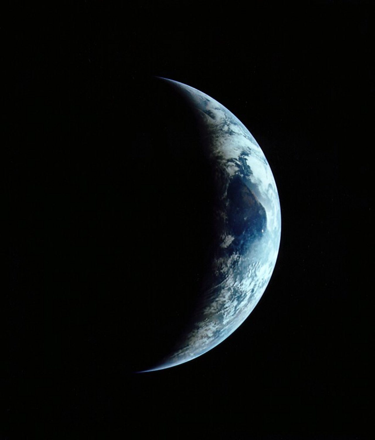 An image of the Earth from space, appearing as a crescent.