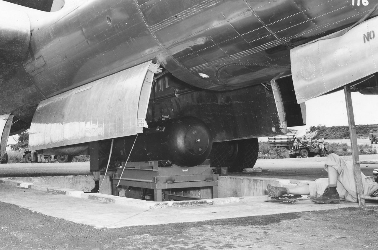 Little Boy being loaded into the plane that will carry it to its final destination.