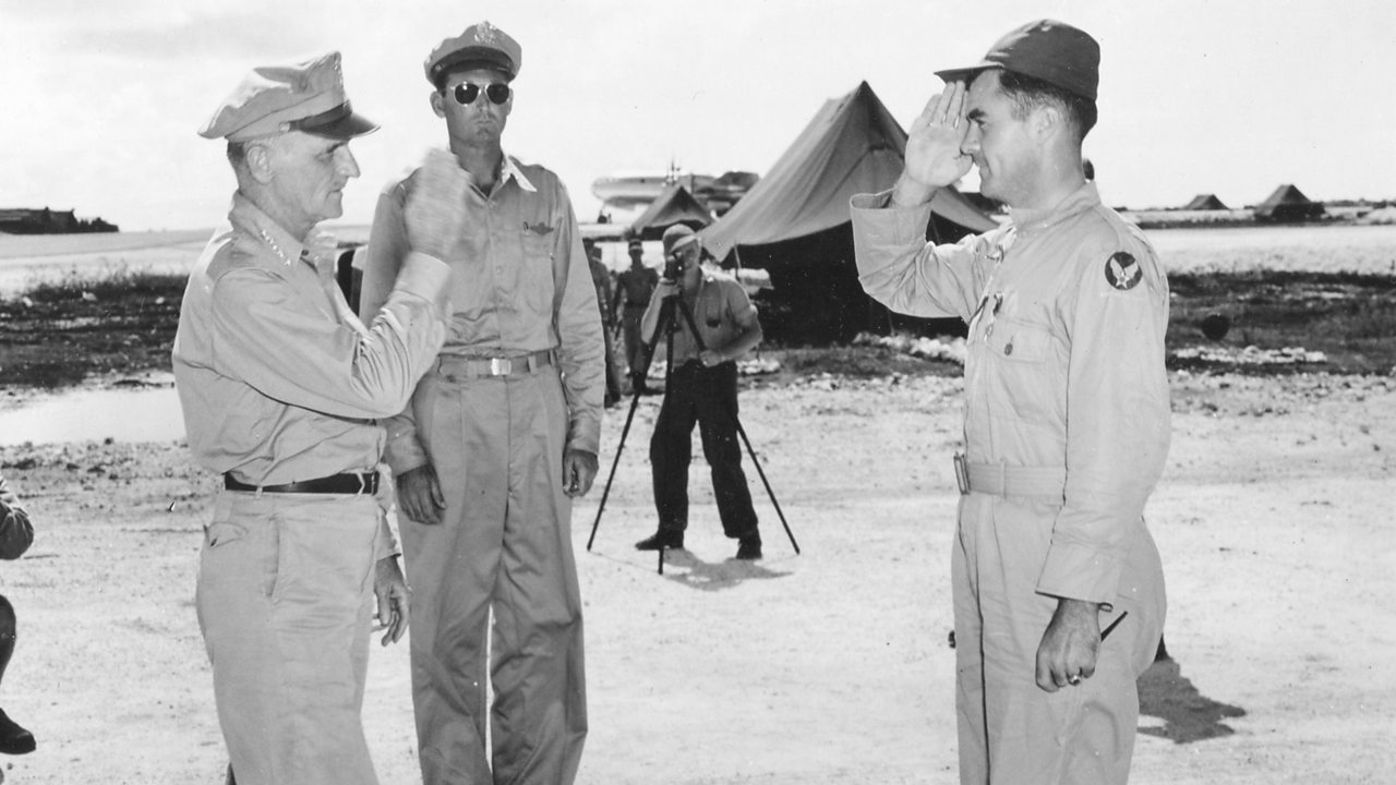 Tibbets being presented with the Distinguished Service Cross.