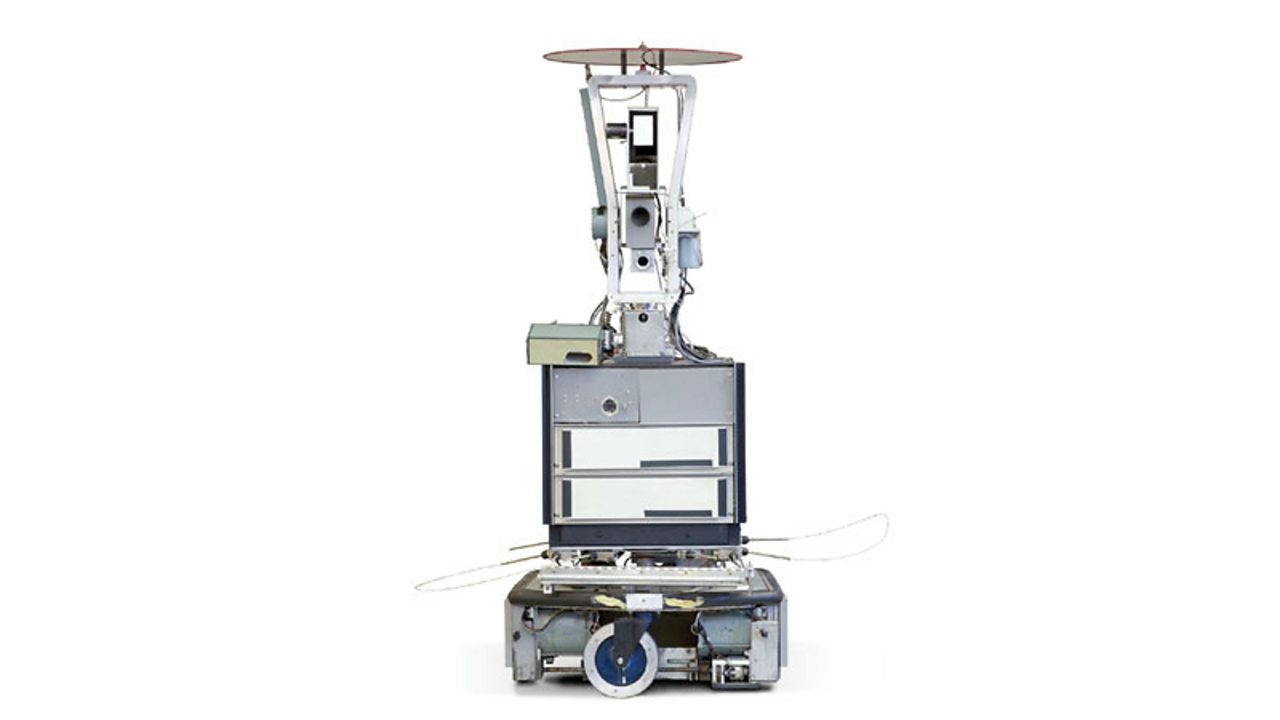 Shakey, the first general-purpose mobile robot able to make decisions about its own actions by reasoning about its surroundings.