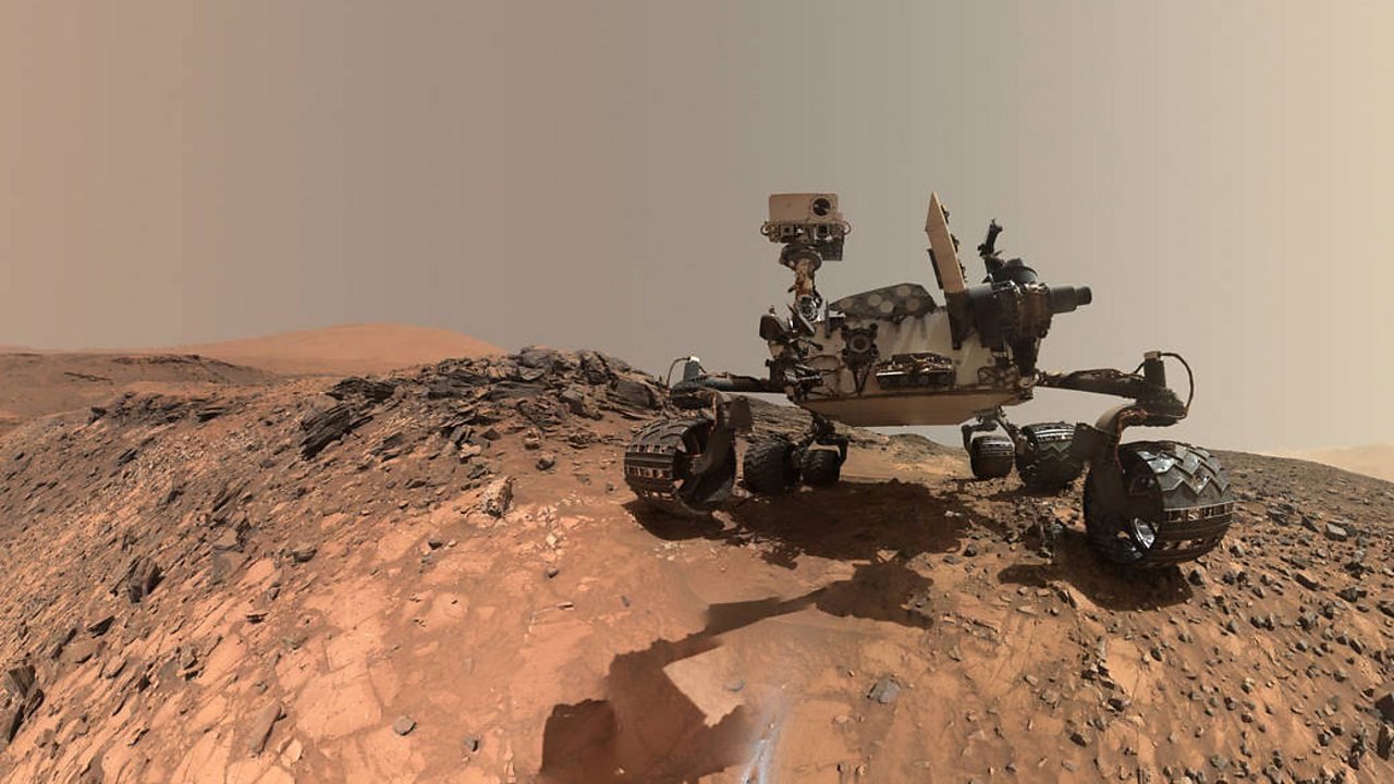 The Curiosity rover on the surface of Mars.