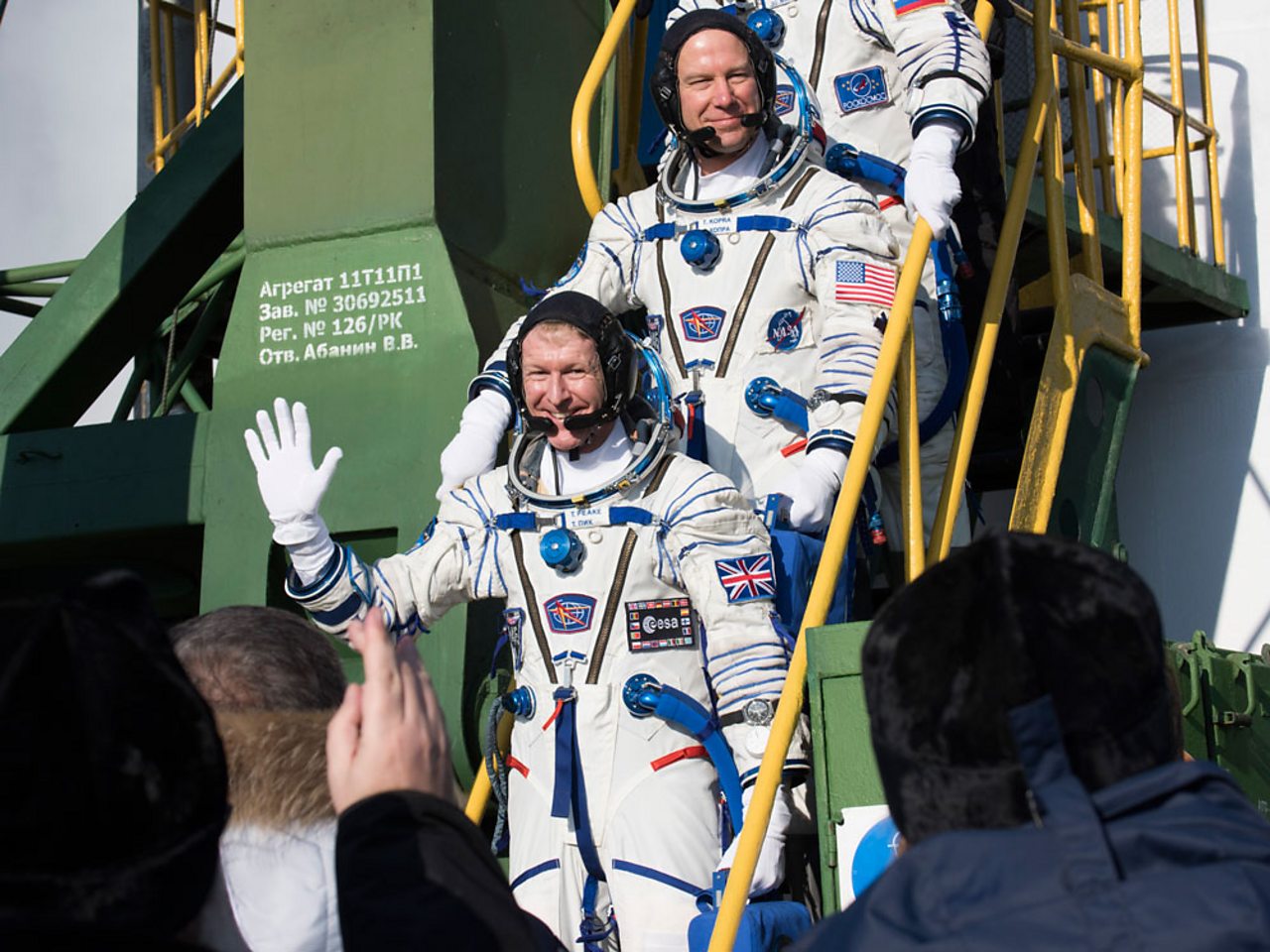 Tim Peake waving goodbye from the steps of the Soyuz rocket.