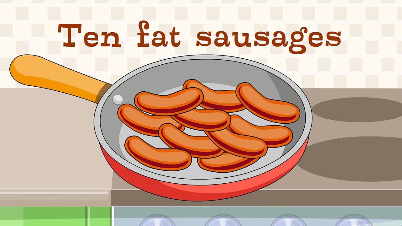 Ten fat sausages sizzling in a pan