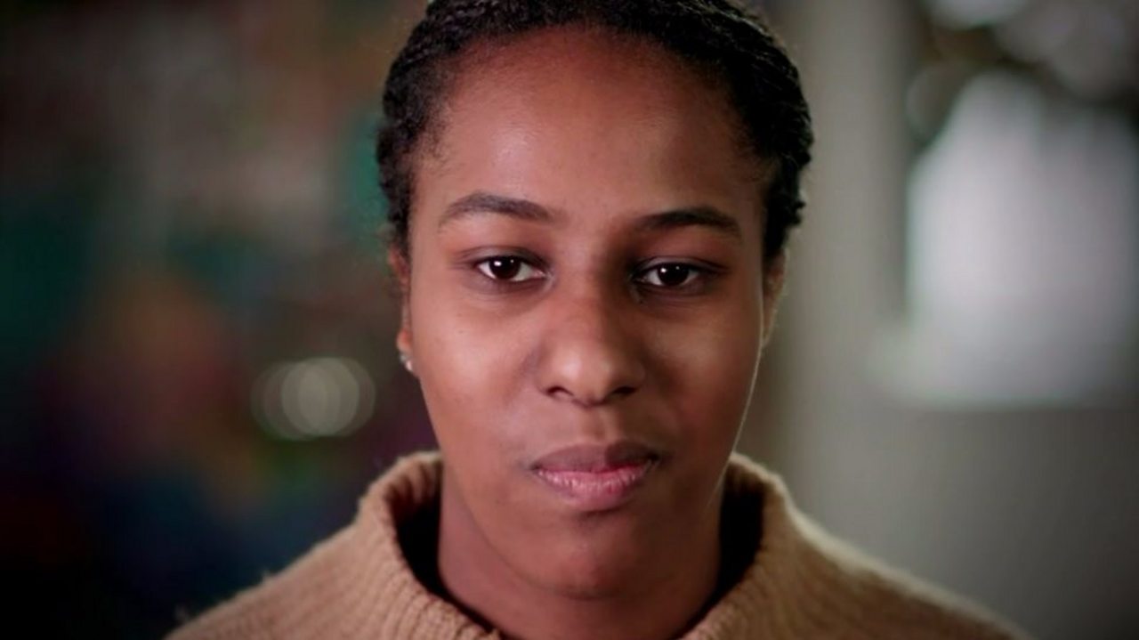 An image of someone chewing a cracker