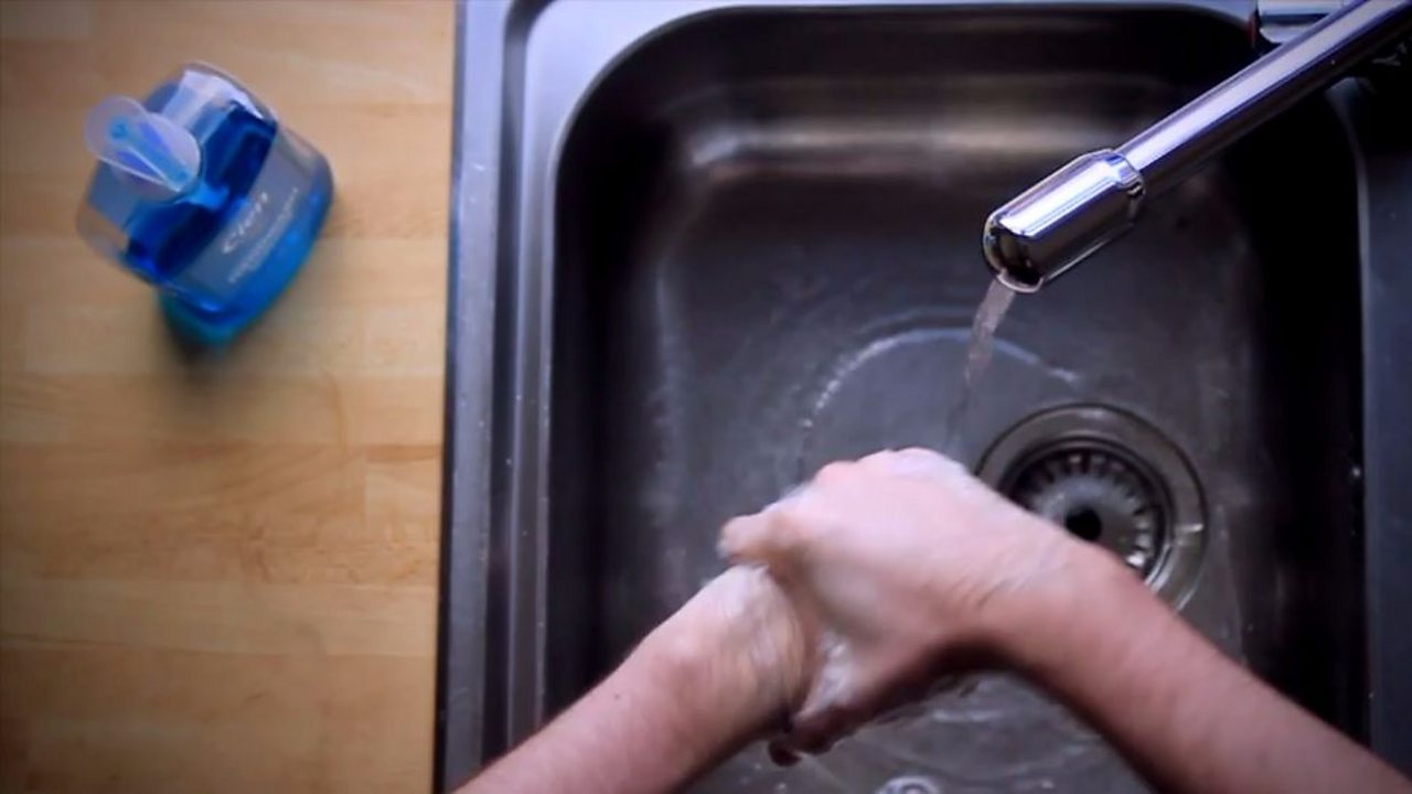 Someone washing their hands
