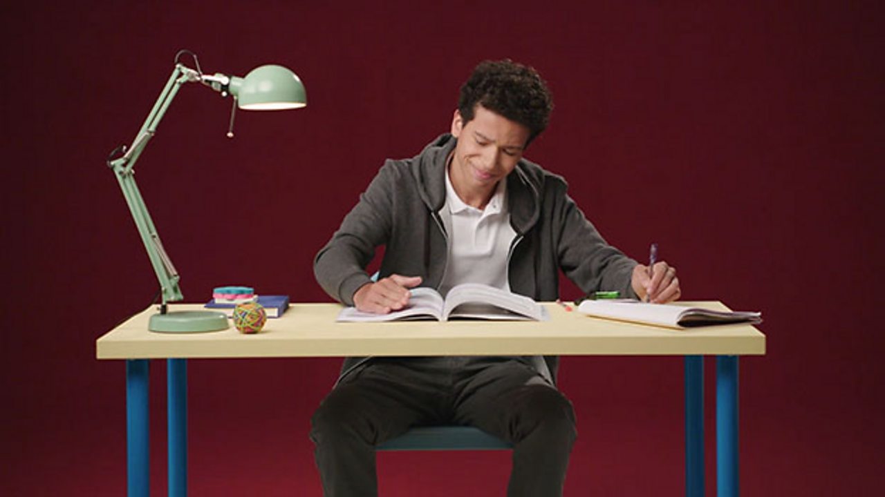Boy working at his desk.