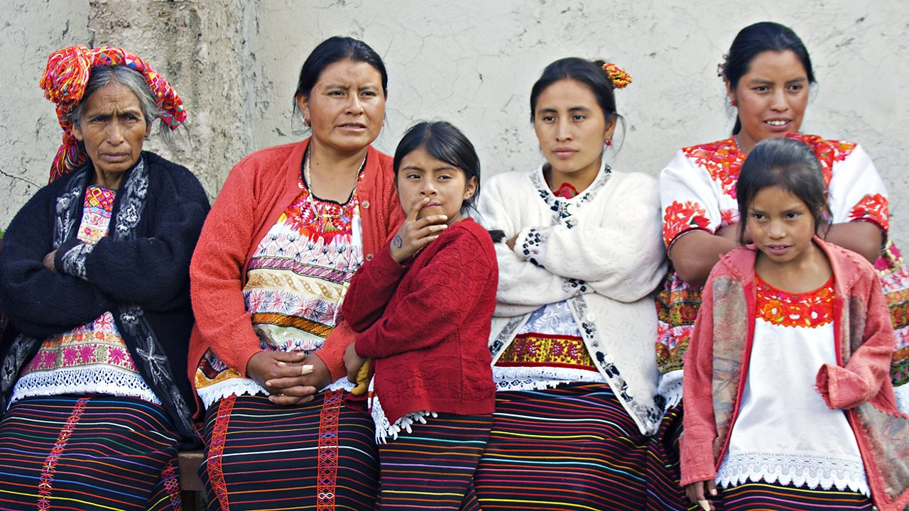 An image of three generations of Maya women