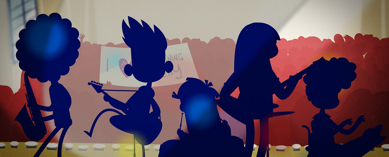 A silhouette of the band playing on stage.