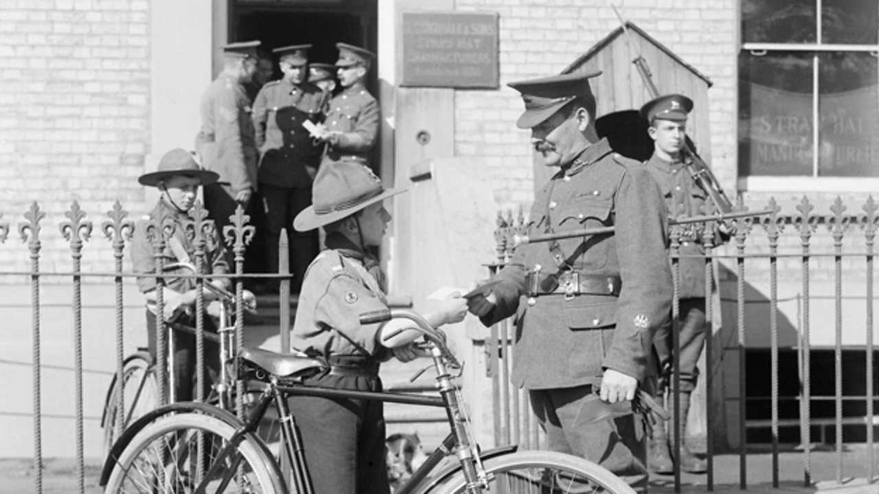 A boy scout delivering a message to a solder at the war office in World War One