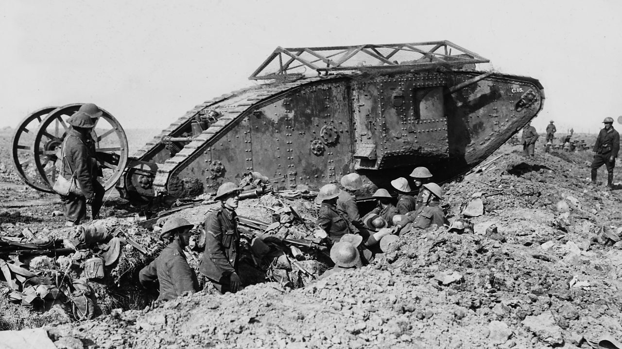 A broken down Mark I tank across a British trench on the way to attack in World War One