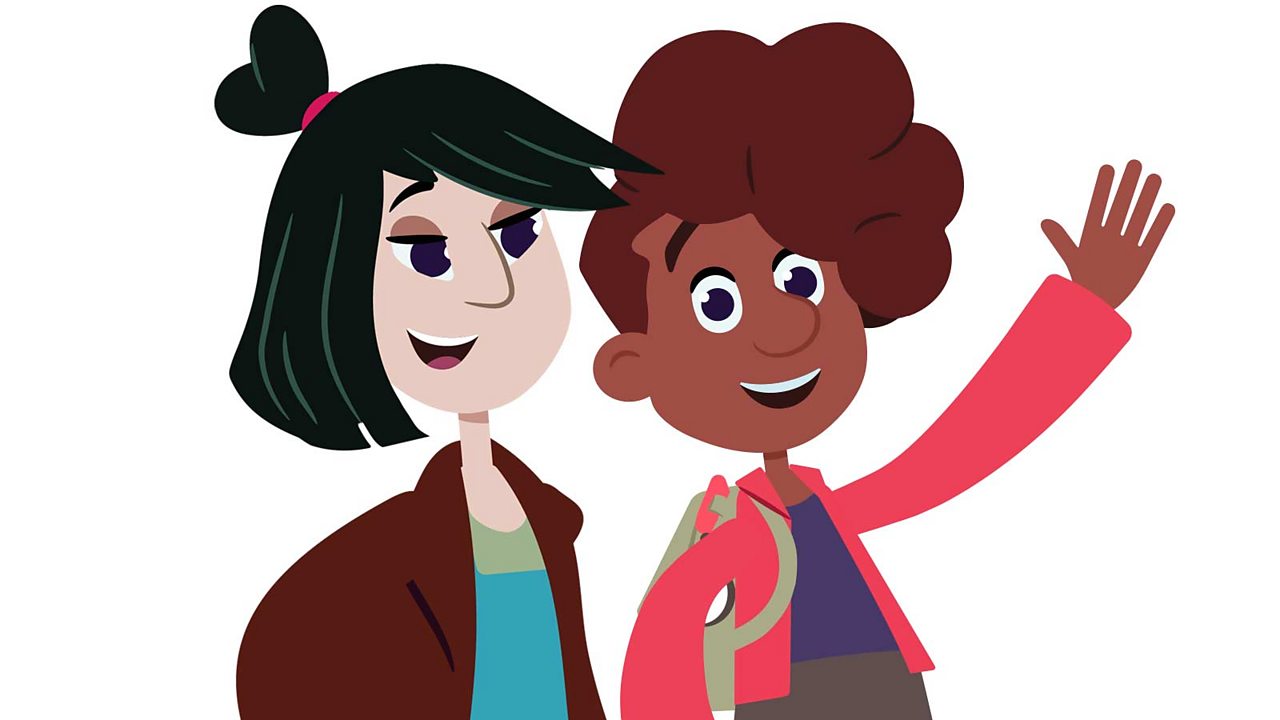 Two girls looking happy. one of them is waving
