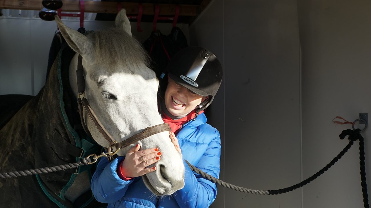 Evie with a horse.
