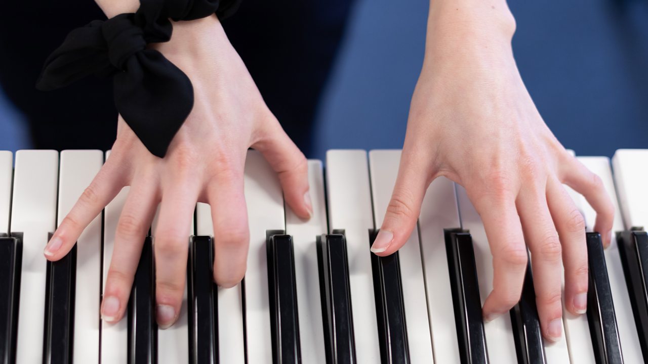 Isabel playing the piano.