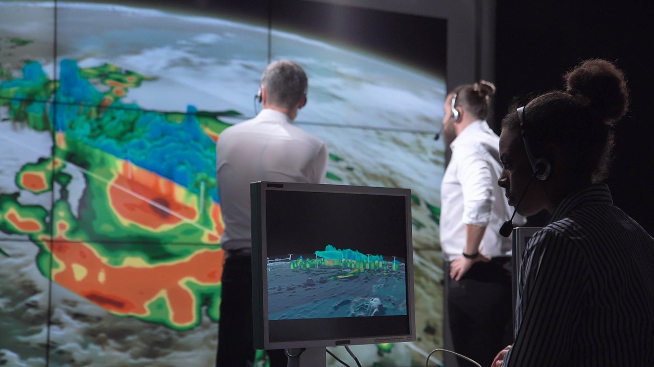 Meterologists investigating a hurricane.