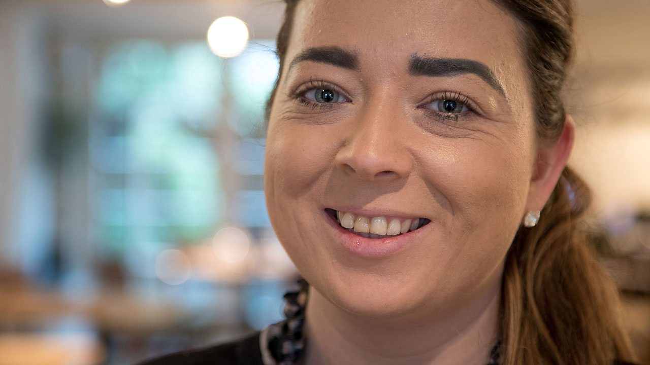 Larissa smiling.