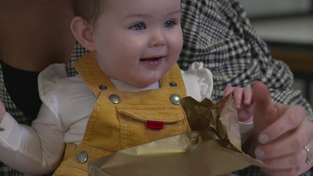Baby with wrapped parcel