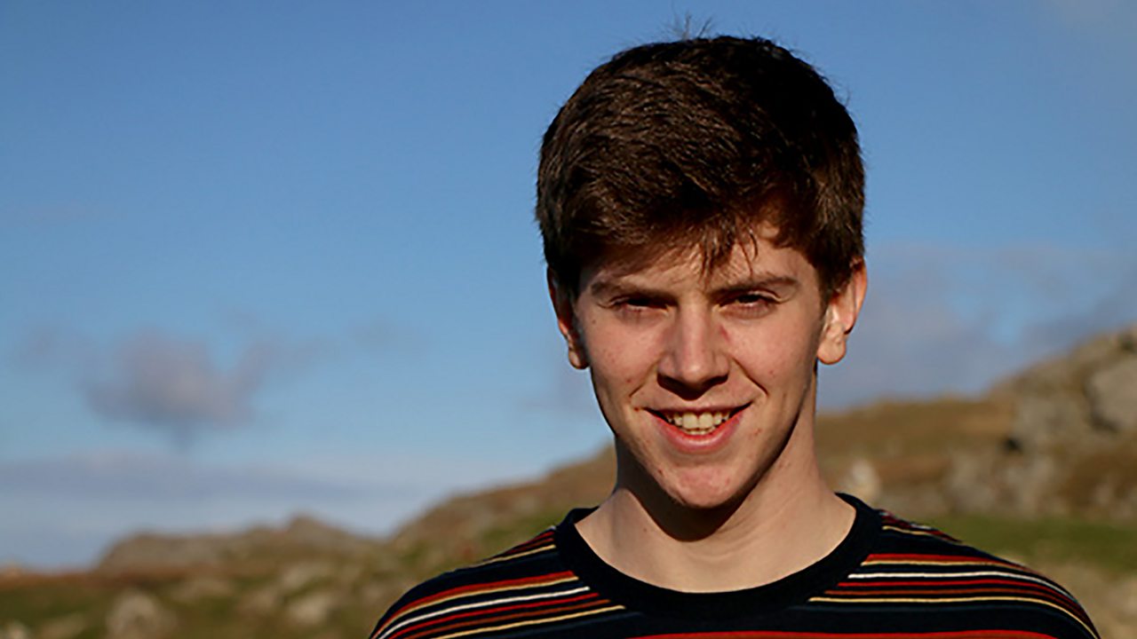 Callum smiling at the camera.
