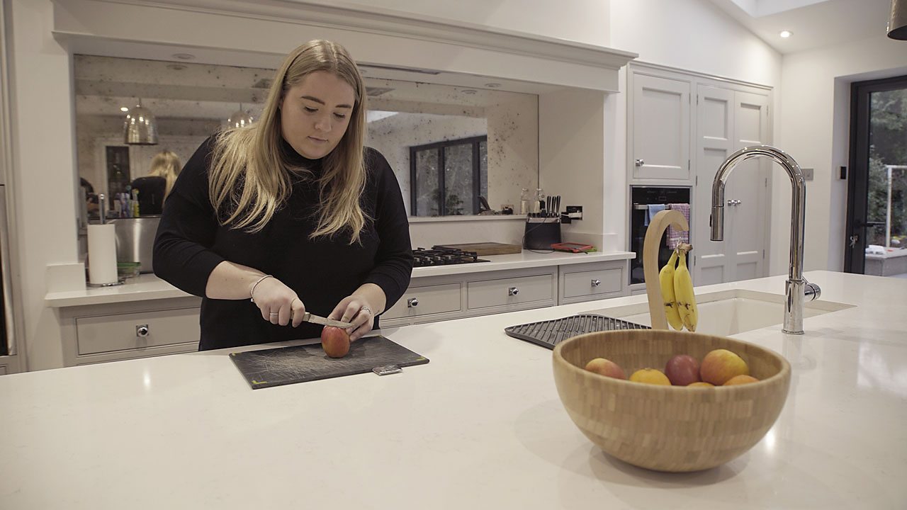 Nichol preparing food in the kitchen