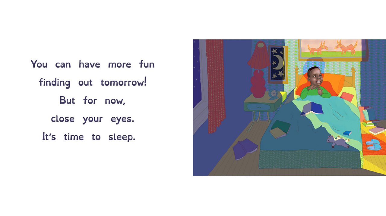 A boy sits up in bed looking very awake.
