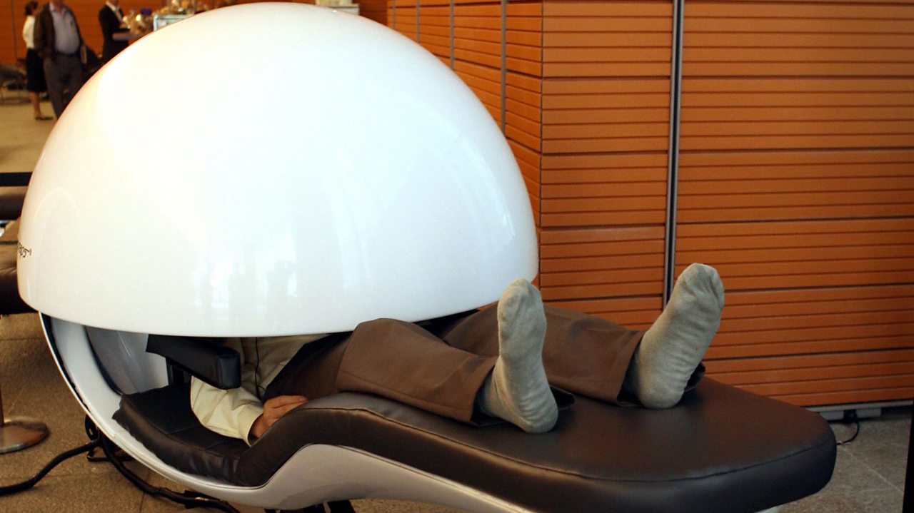 Someone using a nap pod.