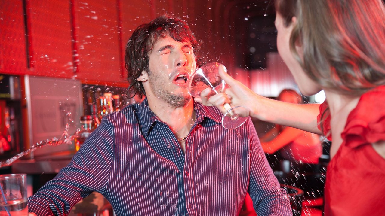 Man getting a drink thrown over him