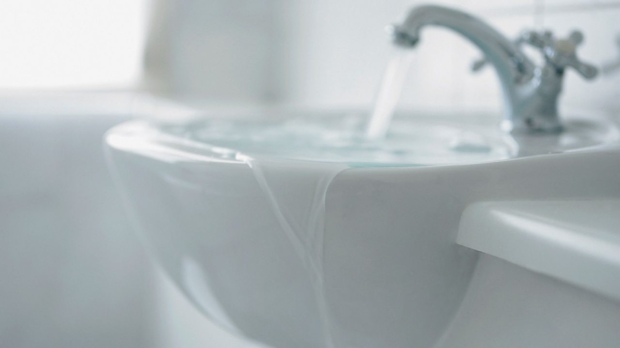 A sink overflowing.