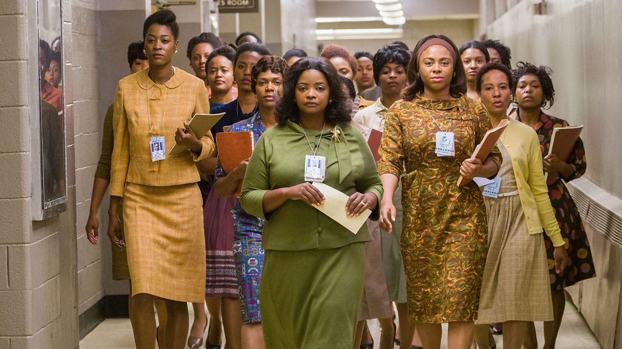 Dorothy and her team walking confidently down the hallway.